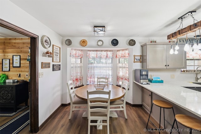 22547 S Dogwood Ct, Claremore, OK 74019 - dining area featuring dark wood finished floors and baseboards