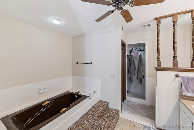 22547 S Dogwood Ct, Claremore, OK 74019 - full bath with vanity, tile patterned flooring, a bath, a ceiling fan, and a walk in shower