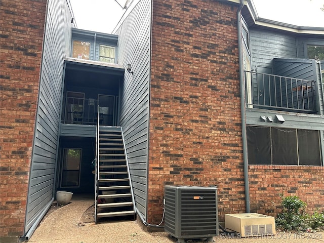 6737 S Peoria Ave Unit C205, Tulsa, OK 74136 - view of side of property with stairs and brick siding