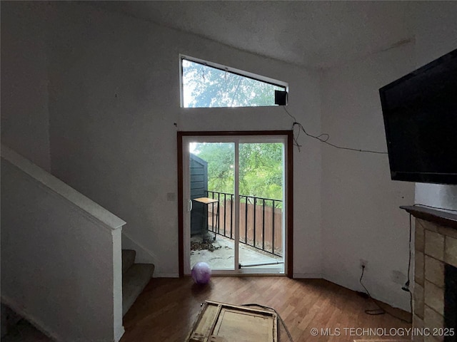6737 S Peoria Ave Unit C205, Tulsa, OK 74136 - doorway to outside featuring wood finished floors and stairs