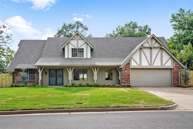 6722 S 72nd E Ave, Tulsa, OK 74133 - tudor house with a garage, concrete driveway, brick siding, a shingled roof, and french doors