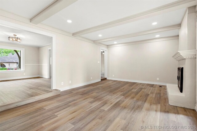 6722 S 72nd E Ave, Tulsa, OK 74133 - unfurnished living room with beam ceiling, light wood-style floors, baseboards, a fireplace with raised hearth, and recessed lighting