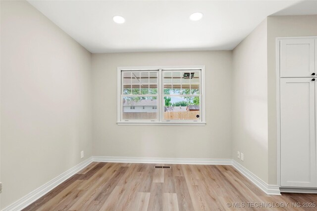 6722 S 72nd E Ave, Tulsa, OK 74133 - unfurnished room with light wood-style flooring, baseboards, and recessed lighting