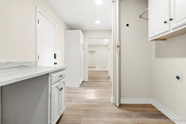 6722 S 72nd E Ave, Tulsa, OK 74133 - washroom featuring hookup for an electric dryer, light wood-style flooring, baseboards, and recessed lighting