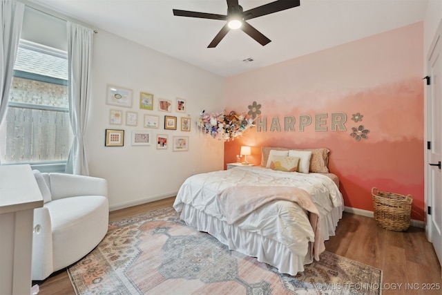 3009 W Van Buren Ct, Broken Arrow, OK 74011 - bedroom with wood finished floors and a ceiling fan