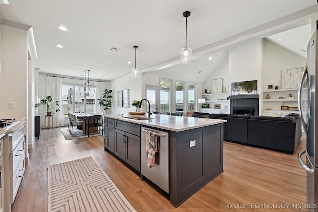 3009 W Van Buren Ct, Broken Arrow, OK 74011 - kitchen featuring stainless steel appliances, a fireplace, recessed lighting, light wood finished floors, and pendant lighting