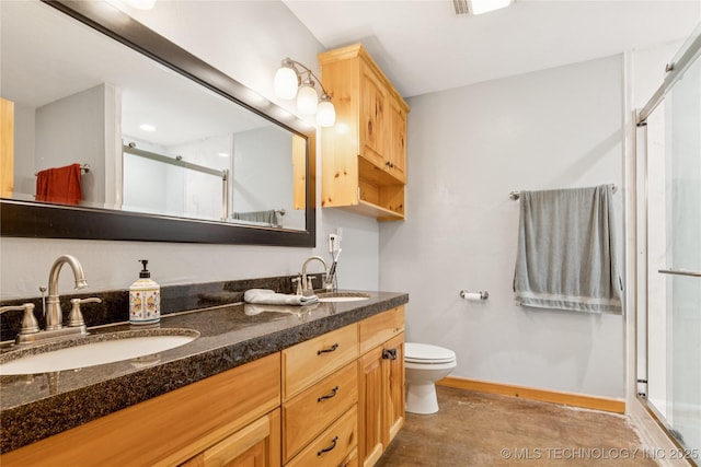 33820 W 261st St S, Bristow, OK 74010 - full bathroom with a shower stall, double vanity, toilet, and baseboards