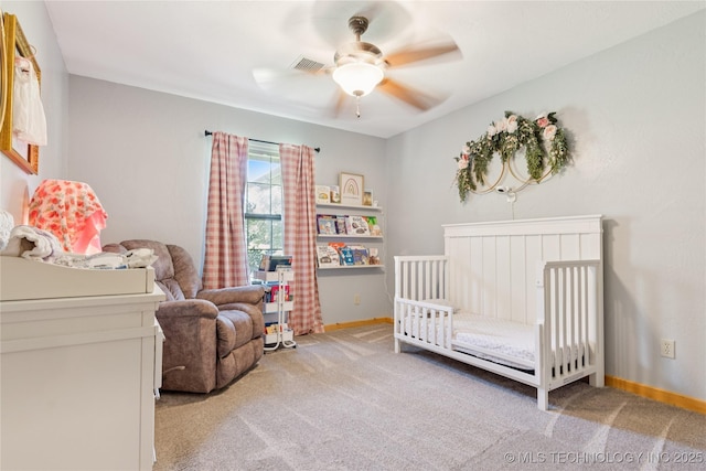 33820 W 261st St S, Bristow, OK 74010 - carpeted bedroom with baseboards, a crib, and a ceiling fan