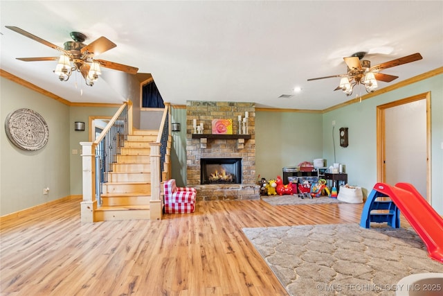 33820 W 261st St S, Bristow, OK 74010 - game room with ceiling fan, wood finished floors, crown molding, a fireplace, and baseboards