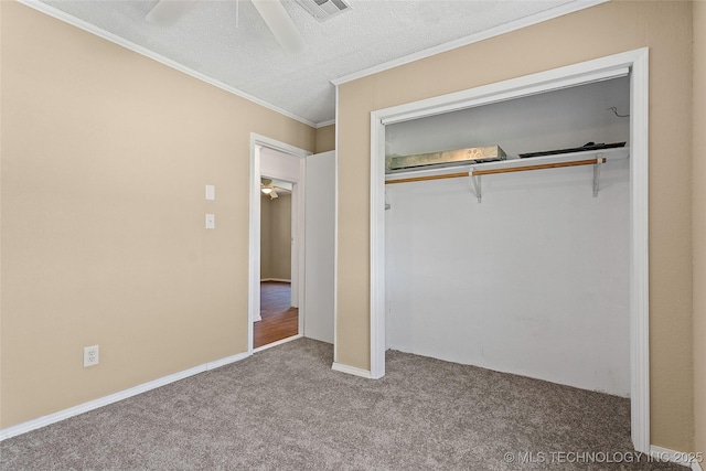 1822 Abner Rd, Overbrook, OK 73453 - unfurnished bedroom featuring carpet floors, crown molding, a closet, a textured ceiling, and a ceiling fan