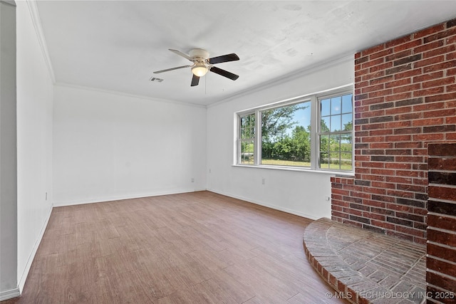1822 Abner Rd, Overbrook, OK 73453 - empty room with wood finished floors, a ceiling fan, crown molding, and baseboards