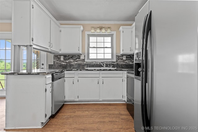 1822 Abner Rd, Overbrook, OK 73453 - kitchen with appliances with stainless steel finishes, a sink, dark countertops, backsplash, and white cabinets