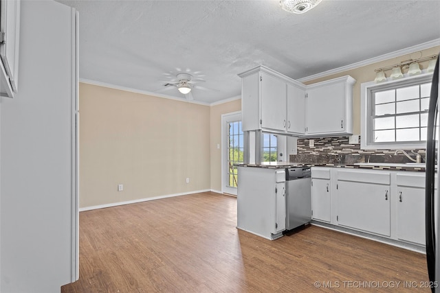 1822 Abner Rd, Overbrook, OK 73453 - kitchen featuring dishwasher, dark wood-type flooring, a sink, backsplash, and dark countertops
