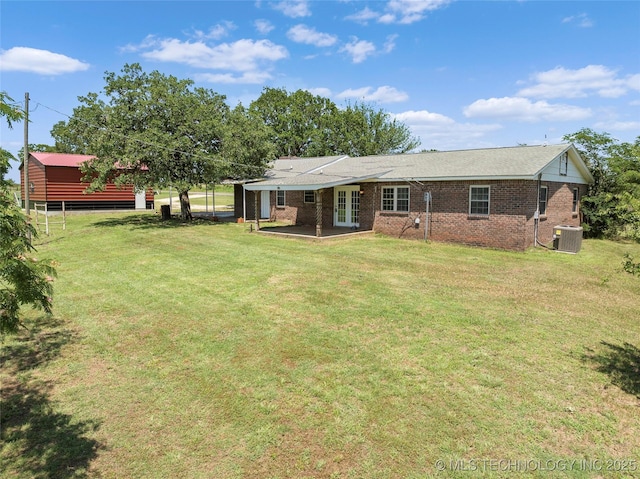 1822 Abner Rd, Overbrook, OK 73453 - back of property with central AC unit, french doors, a patio area, a lawn, and brick siding