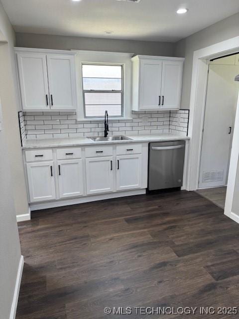 904 W Tishomingo, Madill, OK 73446 - kitchen featuring stainless steel dishwasher, a sink, white cabinets, decorative backsplash, and recessed lighting