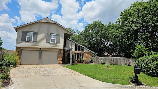 6401 S 86th E Ave, Tulsa, OK 74133 - view of front of house with concrete driveway, a garage, and brick siding