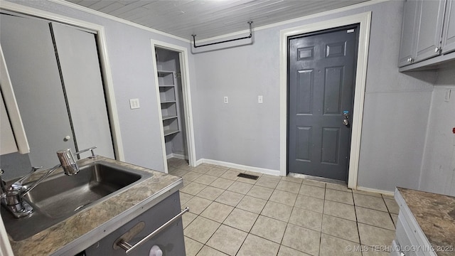6401 S 86th E Ave, Tulsa, OK 74133 - kitchen with light tile patterned floors and crown molding