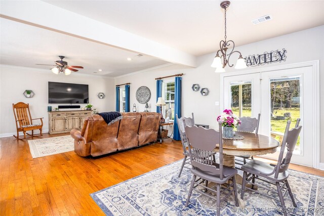 3127 Pleasant Hill Rd, Caddo, OK 74729 - dining area featuring light wood-style floors, a chandelier, a ceiling fan, beamed ceiling, and baseboards