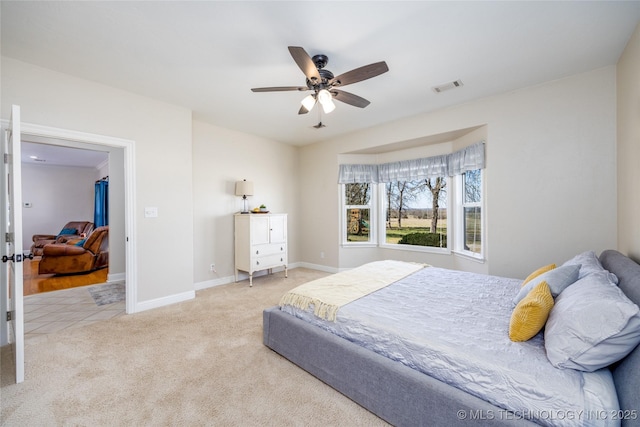3127 Pleasant Hill Rd, Caddo, OK 74729 - carpeted bedroom with baseboards and a ceiling fan