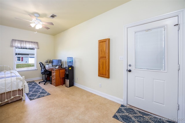 3127 Pleasant Hill Rd, Caddo, OK 74729 - bedroom with light carpet, a desk, baseboards, and a ceiling fan