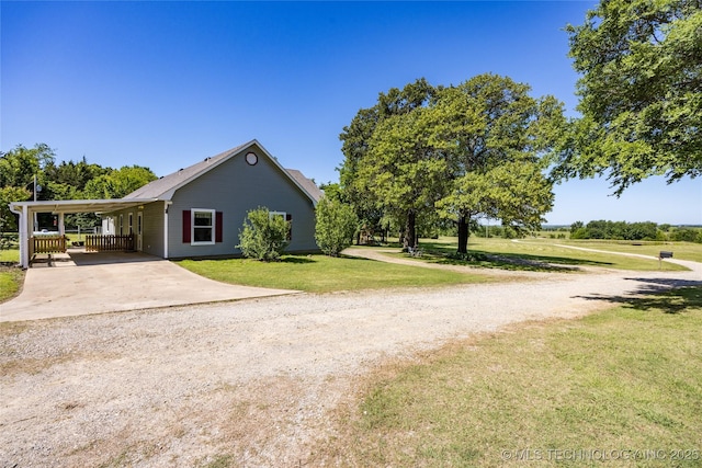3127 Pleasant Hill Rd, Caddo, OK 74729 - view of home's exterior with concrete driveway, a lawn, and a carport