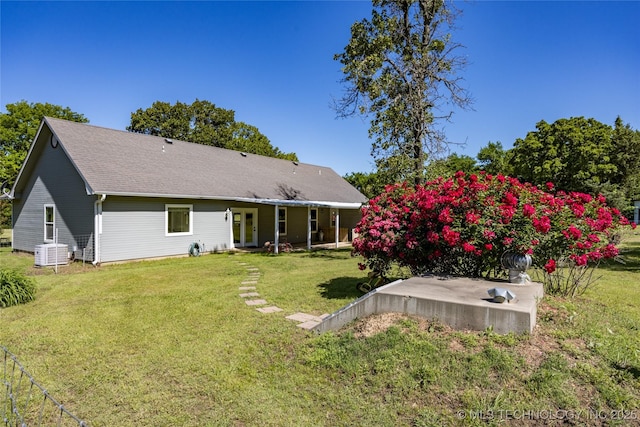 3127 Pleasant Hill Rd, Caddo, OK 74729 - back of property featuring a yard and central air condition unit