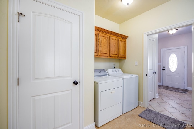 3127 Pleasant Hill Rd, Caddo, OK 74729 - laundry area with washer and clothes dryer, cabinet space, and baseboards