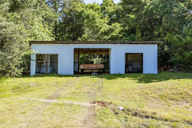 3127 Pleasant Hill Rd, Caddo, OK 74729 - view of pole building with a yard