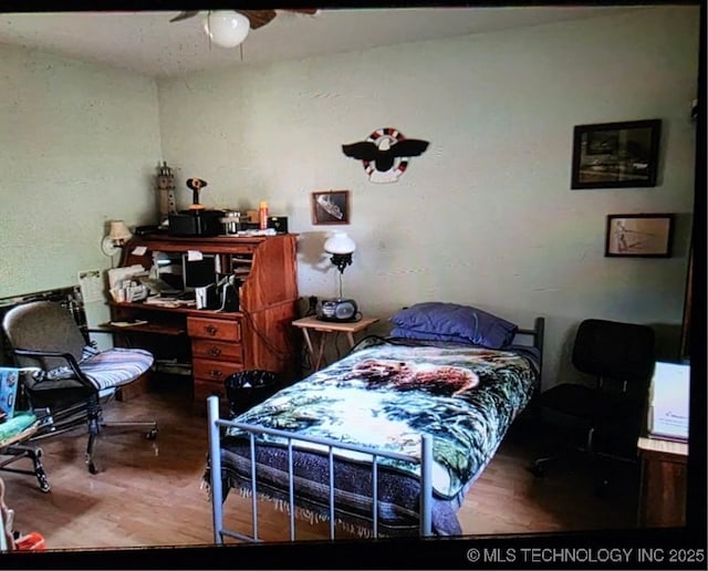 472422 E 754th Rd, Westville, OK 74965 - bedroom featuring wood finished floors and ceiling fan