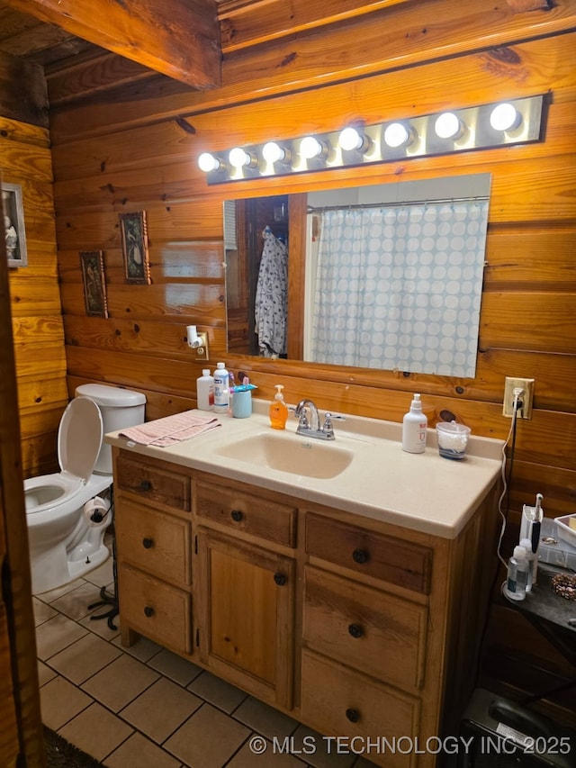 472422 E 754th Rd, Westville, OK 74965 - full bathroom with vanity, tile patterned flooring, toilet, and wood walls