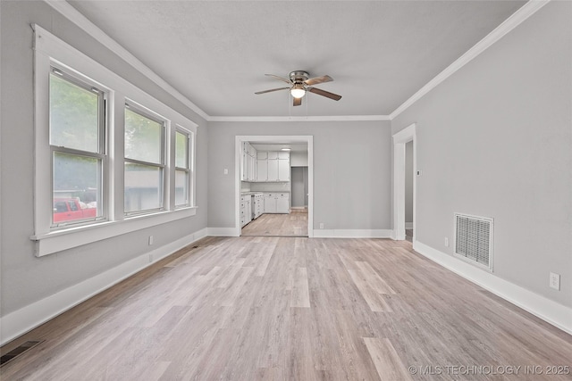 328 I St SW, Ardmore, OK 73401 - unfurnished room with a ceiling fan, light wood finished floors, and crown molding