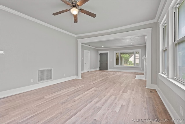 328 I St SW, Ardmore, OK 73401 - unfurnished living room featuring light wood-style flooring, ceiling fan, and crown molding