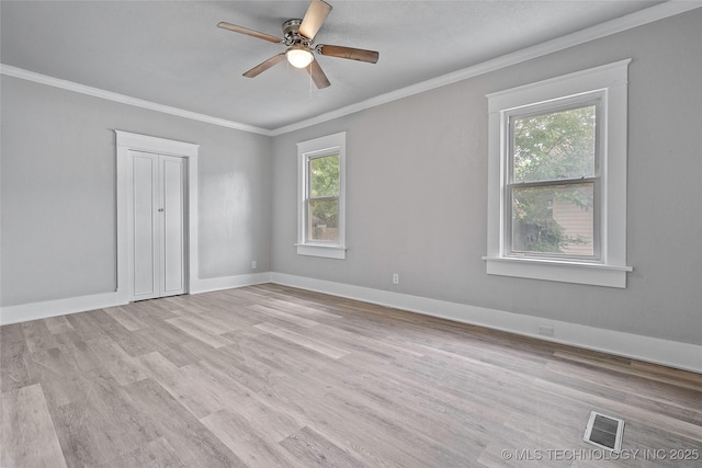 328 I St SW, Ardmore, OK 73401 - empty room with crown molding, ceiling fan, and light wood finished floors