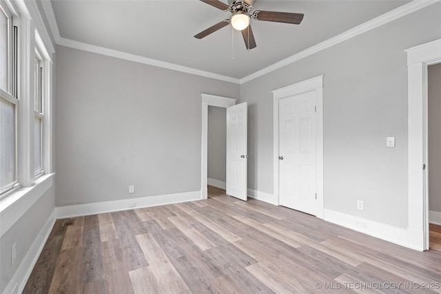 328 I St SW, Ardmore, OK 73401 - unfurnished bedroom with wood finished floors, ornamental molding, and ceiling fan