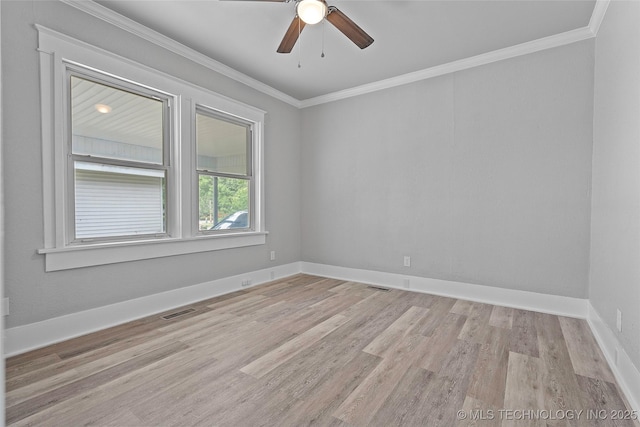 328 I St SW, Ardmore, OK 73401 - unfurnished room with crown molding, light wood-style flooring, and ceiling fan
