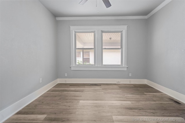 328 I St SW, Ardmore, OK 73401 - empty room with ceiling fan, crown molding, and wood finished floors