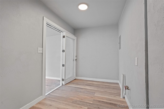 328 I St SW, Ardmore, OK 73401 - corridor featuring light wood-style flooring and baseboards