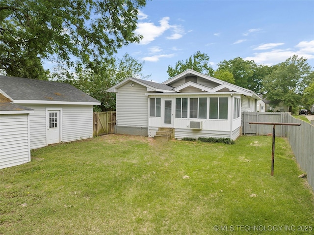 328 I St SW, Ardmore, OK 73401 - rear view of property featuring a fenced backyard, a sunroom, and entry steps