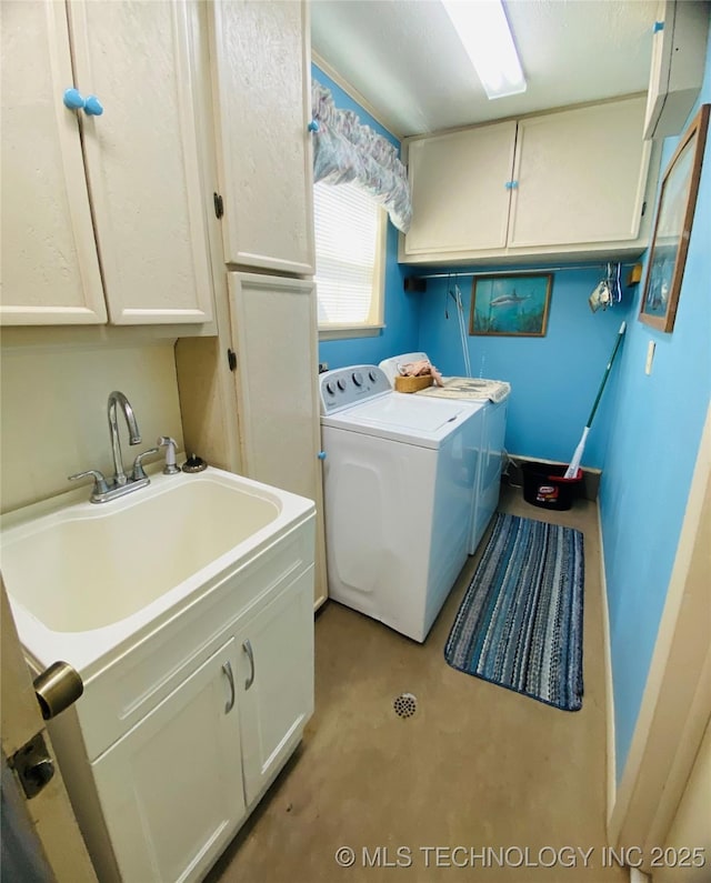 264 SE Main St, Eufaula, OK 74432 - laundry area featuring washing machine and dryer, cabinet space, and baseboards