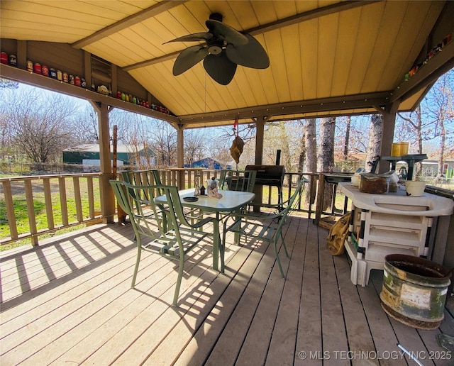 264 SE Main St, Eufaula, OK 74432 - wooden deck featuring a ceiling fan and outdoor dining area