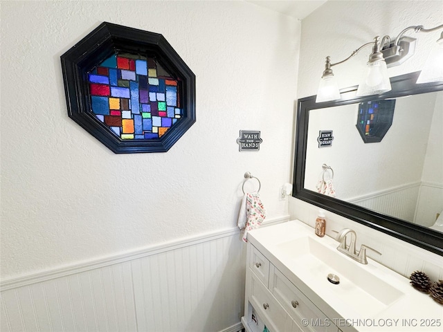 8722 E 74th Pl, Tulsa, OK 74133 - bathroom with vanity and a wainscoted wall