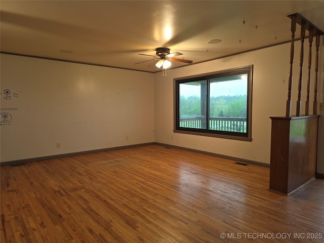 14202 E 492nd Rd, Claremore, OK 74019 - empty room with ceiling fan and wood finished floors