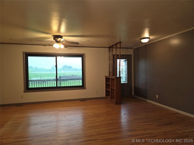 14202 E 492nd Rd, Claremore, OK 74019 - spare room with ceiling fan and wood finished floors