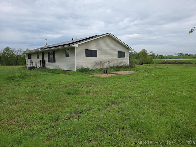 14202 E 492nd Rd, Claremore, OK 74019 - back of property with roof mounted solar panels and a yard
