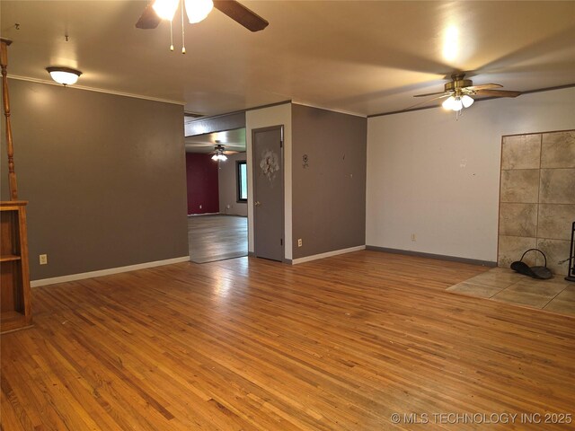 14202 E 492nd Rd, Claremore, OK 74019 - empty room featuring a ceiling fan, wood finished floors, and ornamental molding