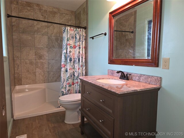 14202 E 492nd Rd, Claremore, OK 74019 - bathroom with vanity, shower / bathtub combination with curtain, and wood finished floors