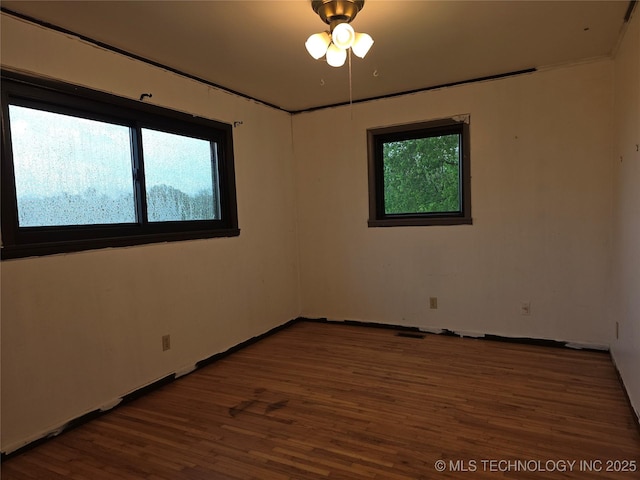 14202 E 492nd Rd, Claremore, OK 74019 - unfurnished room featuring wood finished floors and baseboards