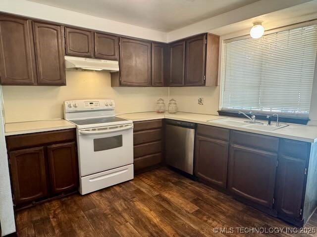 1822 N Xenophon Ave, Tulsa, OK 74127 - kitchen with white electric range oven, stainless steel dishwasher, under cabinet range hood, dark wood-type flooring, and light countertops