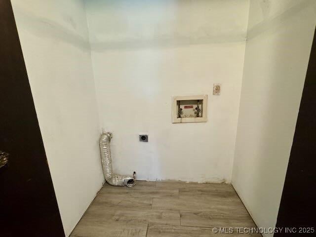 1822 N Xenophon Ave, Tulsa, OK 74127 - laundry area featuring hookup for an electric dryer, hookup for a washing machine, and light wood-type flooring