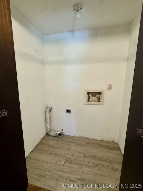 1822 N Xenophon Ave, Tulsa, OK 74127 - washroom featuring hookup for an electric dryer, hookup for a washing machine, and wood finished floors